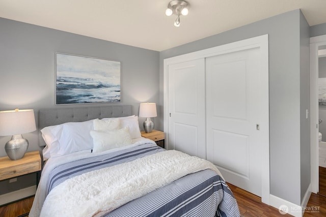 610 Aloha St Unit 303, Seattle, WA 98109 - bedroom featuring a closet, wood finished floors, and baseboards
