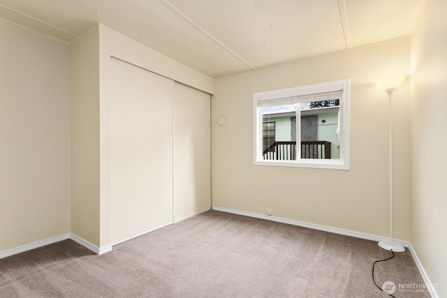 8322 19th Ave Court E Unit 11, Tacoma, WA 98404 - unfurnished bedroom featuring carpet flooring and baseboards