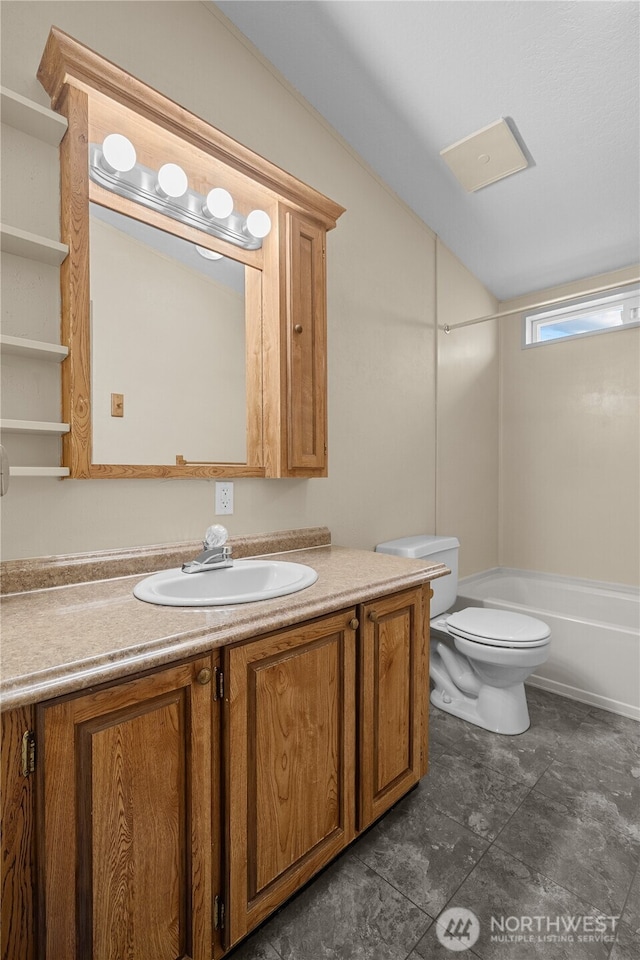 bathroom featuring vanity, toilet, bathtub / shower combination, and lofted ceiling