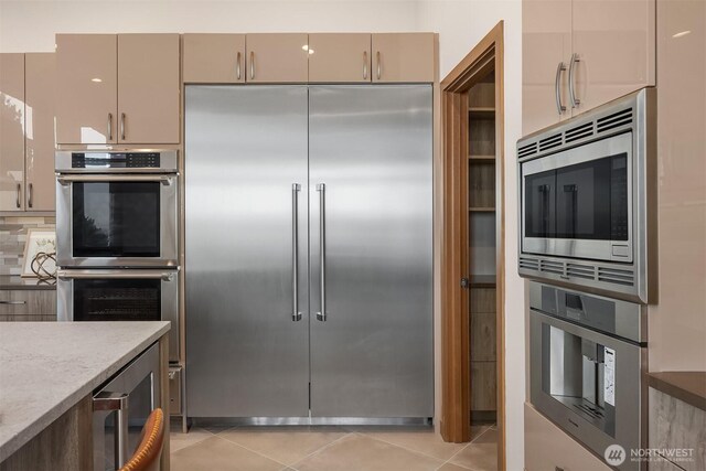 8553 NE Juanita Dr, Kirkland, WA 98034 - kitchen with built in appliances, light tile patterned floors, and wine cooler