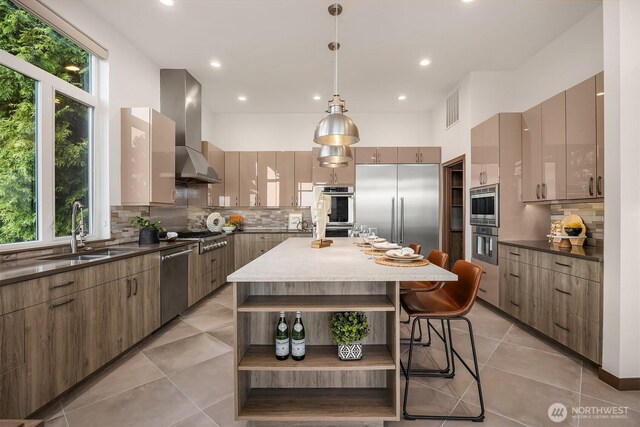 8553 NE Juanita Dr, Kirkland, WA 98034 - kitchen featuring open shelves, built in appliances, backsplash, modern cabinets, and wall chimney exhaust hood