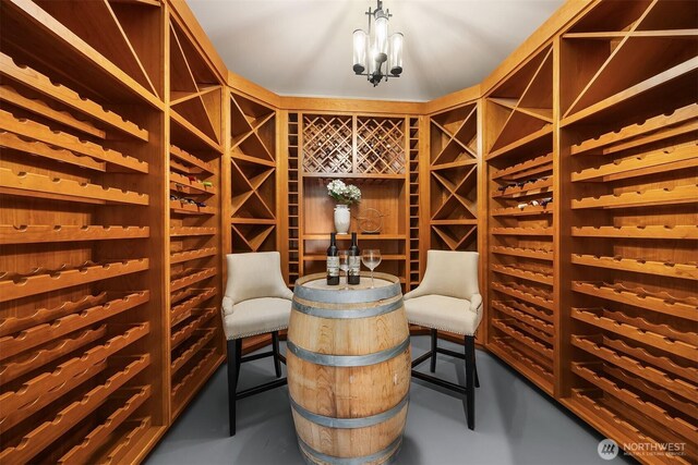 8553 NE Juanita Dr, Kirkland, WA 98034 - wine cellar with finished concrete floors and a chandelier