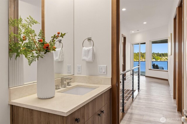 8553 NE Juanita Dr, Kirkland, WA 98034 - bathroom featuring vanity, recessed lighting, and wood finished floors