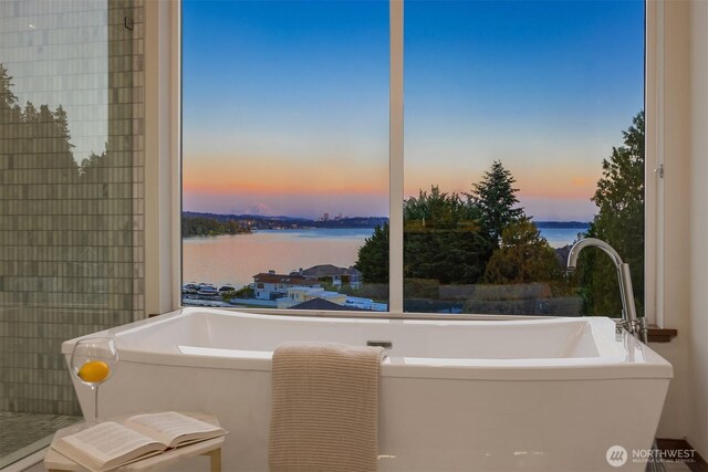 8553 NE Juanita Dr, Kirkland, WA 98034 - full bathroom featuring a soaking tub and a water view