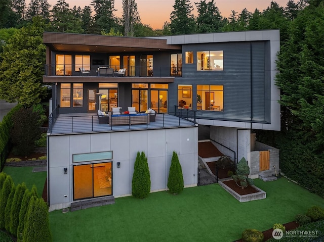 8553 NE Juanita Dr, Kirkland, WA 98034 - rear view of house featuring a balcony, a lawn, and board and batten siding