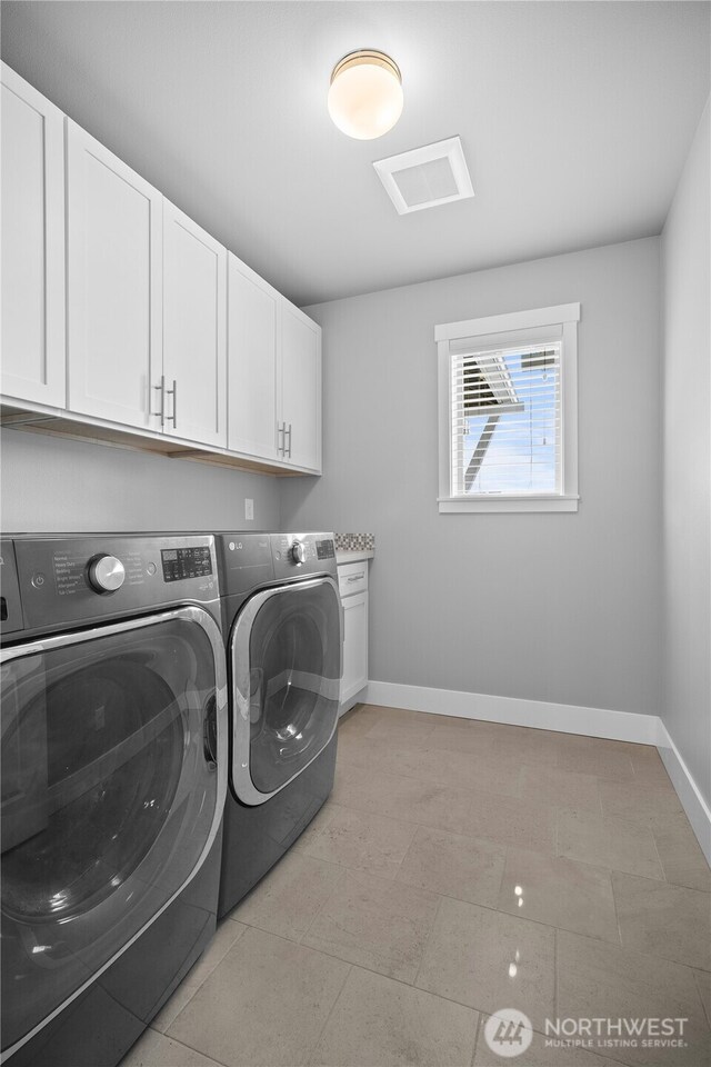 13127 184th Ave E, Bonney Lake, WA 98391 - washroom with washing machine and clothes dryer, cabinet space, and baseboards