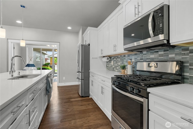 13127 184th Ave E, Bonney Lake, WA 98391 - kitchen featuring appliances with stainless steel finishes, a sink, backsplash, light countertops, and recessed lighting