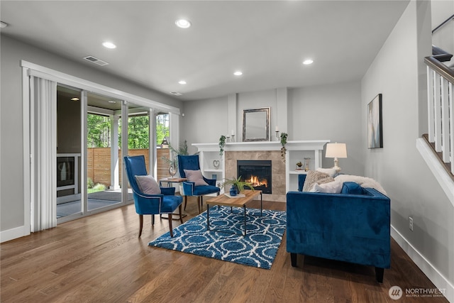 13127 184th Ave E, Bonney Lake, WA 98391 - living area featuring a fireplace, stairs, wood finished floors, baseboards, and recessed lighting