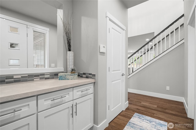 13127 184th Ave E, Bonney Lake, WA 98391 - bathroom featuring backsplash, wood finished floors, baseboards, and vanity