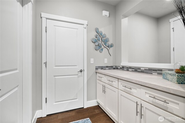 13127 184th Ave E, Bonney Lake, WA 98391 - bathroom with wood finished floors, vanity, and baseboards