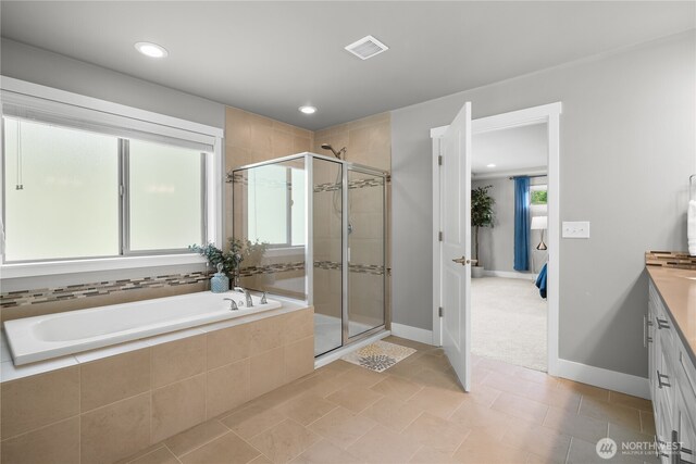 13127 184th Ave E, Bonney Lake, WA 98391 - bathroom with a bath, vanity, a stall shower, baseboards, and recessed lighting