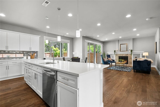 13127 184th Ave E, Bonney Lake, WA 98391 - kitchen with stainless steel dishwasher, a sink, open floor plan, recessed lighting, and light countertops
