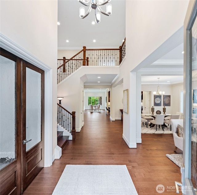 9827 NE 20th St, Bellevue, WA 98004 - entrance foyer featuring a chandelier, stairs, wood finished floors, a towering ceiling, and ornamental molding