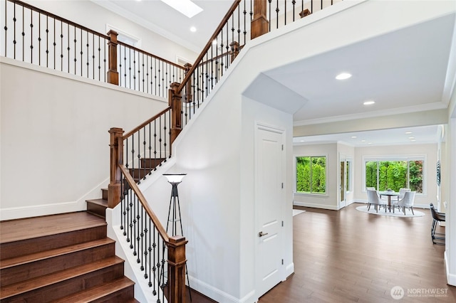 9827 NE 20th St, Bellevue, WA 98004 - staircase featuring ornamental molding, wood finished floors, recessed lighting, and baseboards