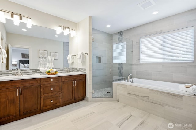 9827 NE 20th St, Bellevue, WA 98004 - full bathroom featuring a garden tub, a stall shower, double vanity, ensuite bath, and decorative backsplash