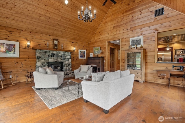 5410 SW 244th St, Vashon, WA 98070 - living room with wooden walls, high vaulted ceiling, hardwood / wood-style flooring, a chandelier, and wooden ceiling