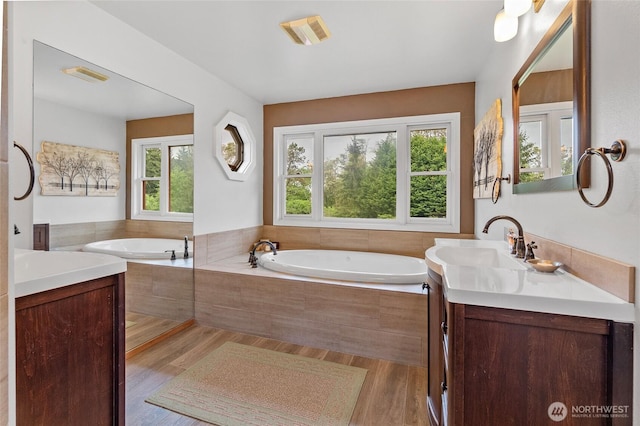 5410 SW 244th St, Vashon, WA 98070 - full bath featuring vanity, wood finished floors, and a garden tub