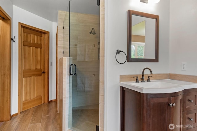 5410 SW 244th St, Vashon, WA 98070 - bathroom with a stall shower, vanity, and wood finished floors
