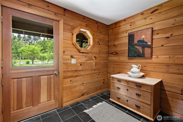 5410 SW 244th St, Vashon, WA 98070 - entryway with dark tile patterned floors and wood walls