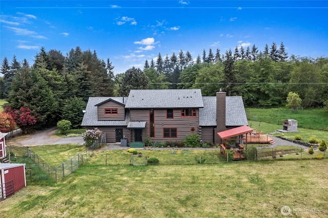 5410 SW 244th St, Vashon, WA 98070 - rear view of house with a shingled roof and a chimney