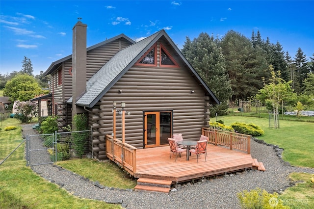 5410 SW 244th St, Vashon, WA 98070 - back of property with log siding, a chimney, a deck, a gate, and a shingled roof