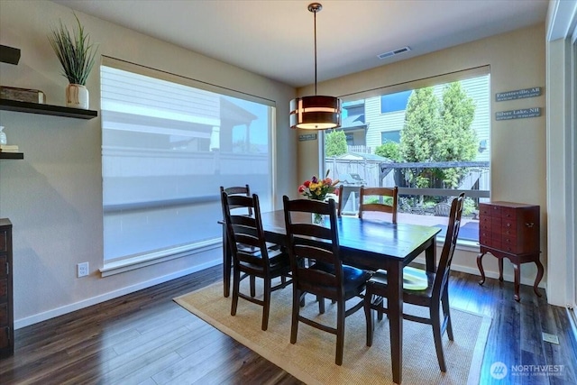13406 SE 262nd St, Kent, WA 98042 - dining space featuring dark wood-type flooring and baseboards