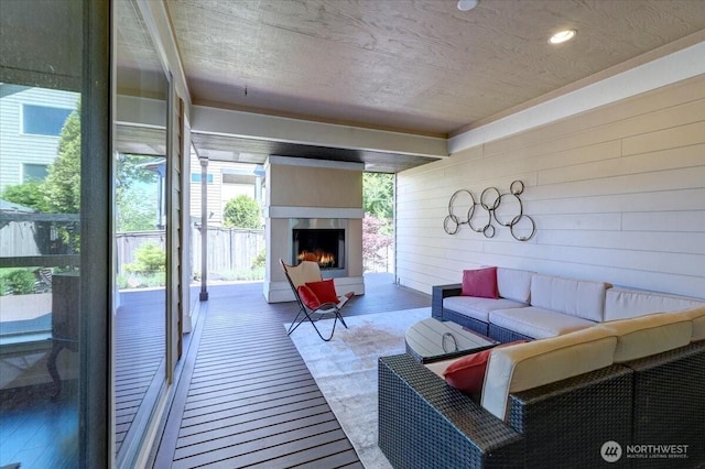 13406 SE 262nd St, Kent, WA 98042 - living area featuring wood walls, a warm lit fireplace, and wood finished floors