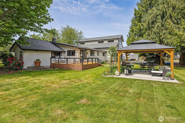 13925 80th St E, Puyallup, WA 98372 - back of house featuring a gazebo, a lawn, a wooden deck, and a patio