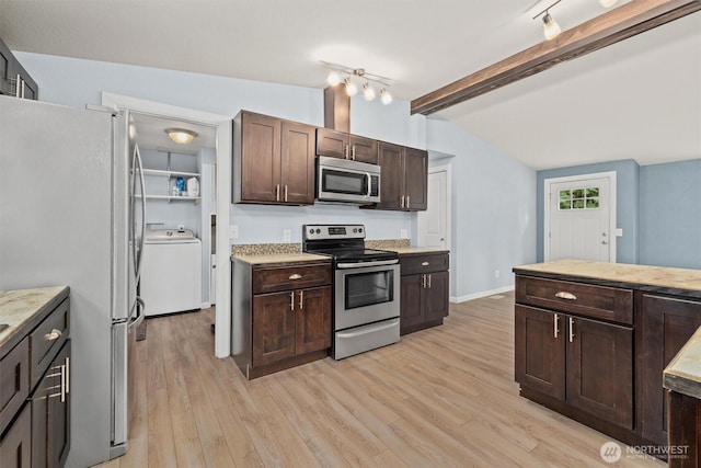 kitchen with stainless steel appliances, washer / dryer, dark brown cabinets, light wood-type flooring, and baseboards
