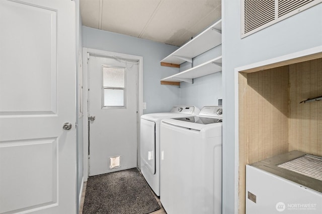 laundry area featuring independent washer and dryer