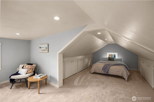 bedroom featuring light carpet, lofted ceiling, baseboards, and recessed lighting
