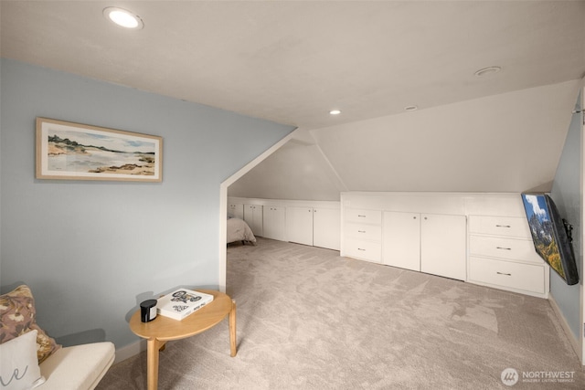 additional living space featuring light carpet, recessed lighting, vaulted ceiling, and baseboards