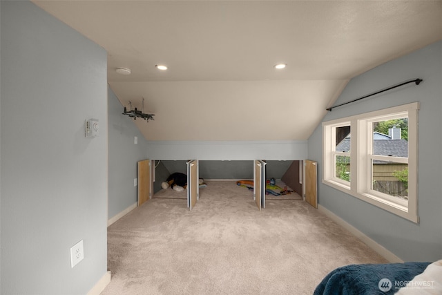 unfurnished bedroom featuring vaulted ceiling, carpet flooring, baseboards, and recessed lighting