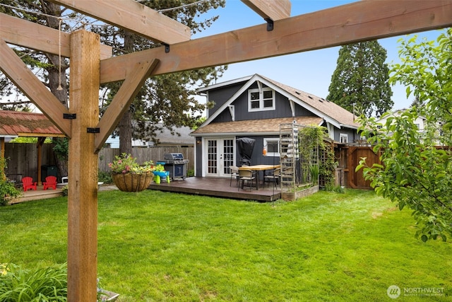 rear view of property featuring french doors, a deck, and a pergola