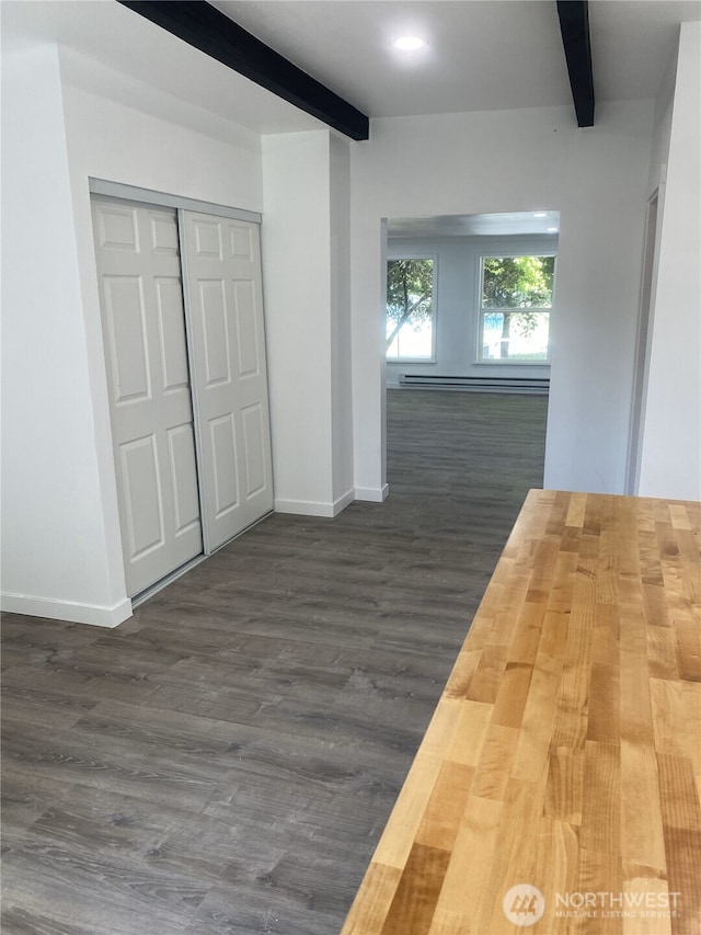 hall with beamed ceiling, baseboards, dark wood-style floors, and a baseboard radiator