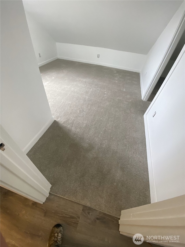 detailed view of carpet flooring and baseboards