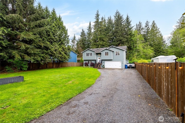 12128 167th Dr NE, Arlington, WA 98223 - split foyer home featuring a garage and driveway