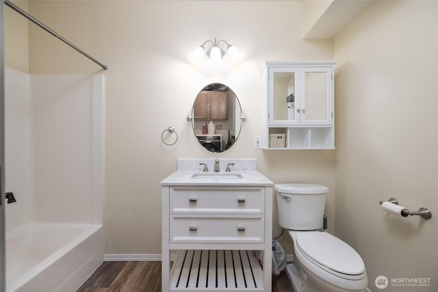 12128 167th Dr NE, Arlington, WA 98223 - full bathroom with wood finished floors, toilet, baseboards, vanity, and shower / bath combination