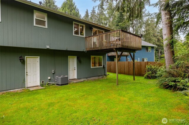 12128 167th Dr NE, Arlington, WA 98223 - rear view of house featuring central AC and a wooden deck