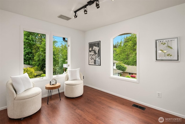 16910 73rd Pl W, Edmonds, WA 98026 - sitting room featuring rail lighting, dark wood-style floors, and baseboards