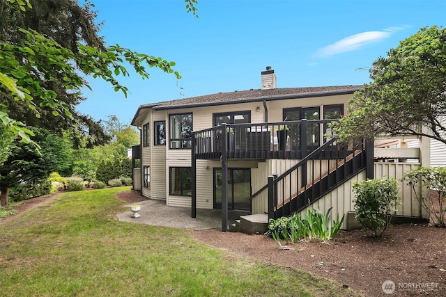 16910 73rd Pl W, Edmonds, WA 98026 - back of house featuring a chimney, a lawn, a patio, stairway, and a wooden deck