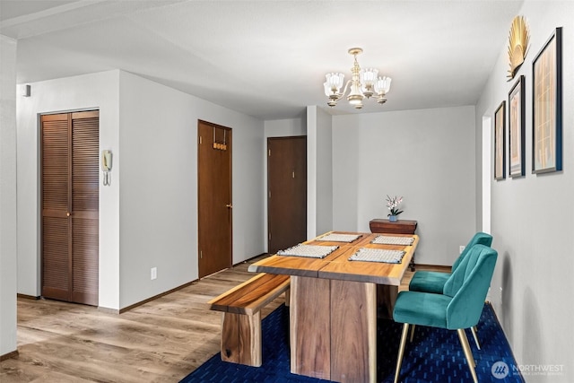 8516 196th St SW Unit 311, Edmonds, WA 98026 - dining space featuring a chandelier, light wood finished floors, and baseboards