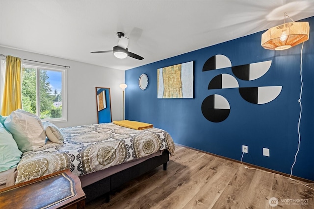 8516 196th St SW Unit 311, Edmonds, WA 98026 - bedroom with wood finished floors, ceiling fan, and baseboards