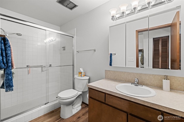 8516 196th St SW Unit 311, Edmonds, WA 98026 - full bathroom featuring toilet, wood finished floors, a shower stall, and vanity