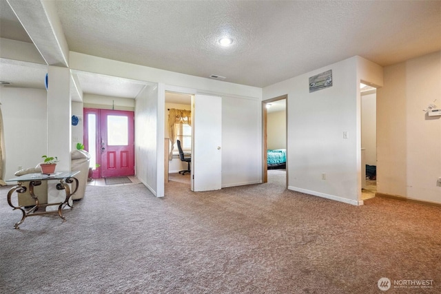 237 Reeds Rd, Touchet, WA 99360 - foyer featuring a textured ceiling, carpet floors, and baseboards