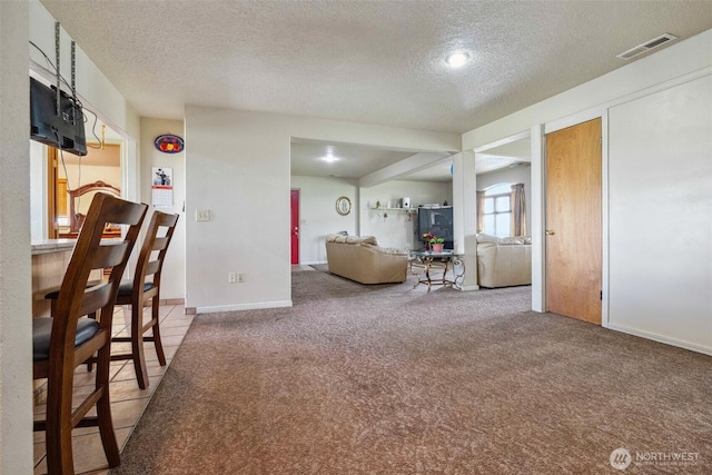 237 Reeds Rd, Touchet, WA 99360 - living room with a textured ceiling, carpet flooring, and baseboards