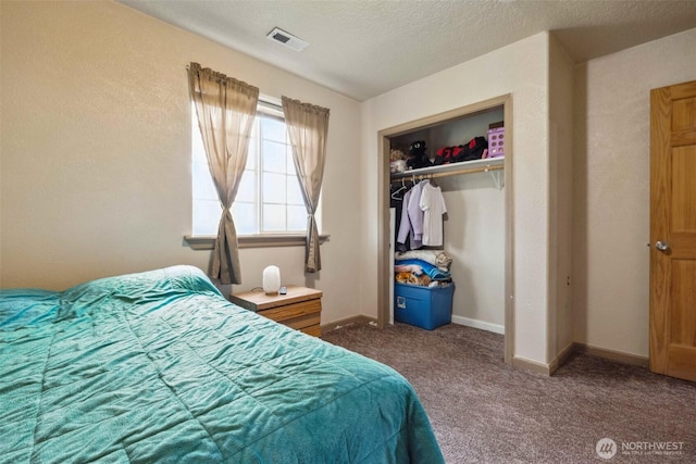 237 Reeds Rd, Touchet, WA 99360 - bedroom featuring carpet, a closet, baseboards, and a textured ceiling