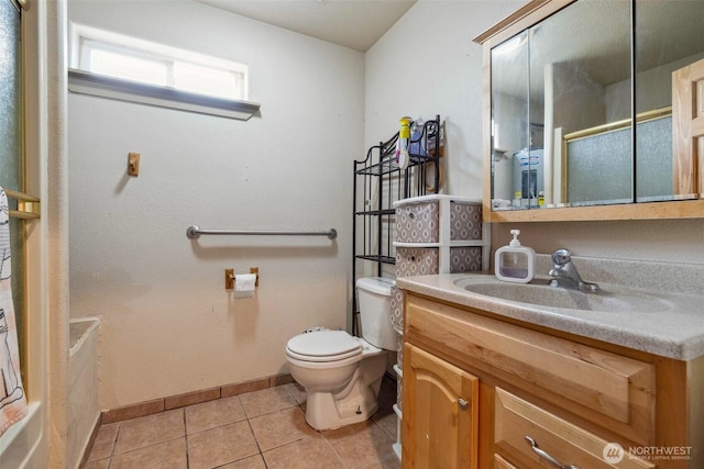 237 Reeds Rd, Touchet, WA 99360 - full bath with toilet, vanity, baseboards, tile patterned floors, and a shower with shower door