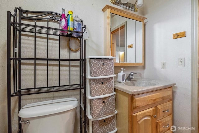 237 Reeds Rd, Touchet, WA 99360 - half bathroom featuring toilet and vanity