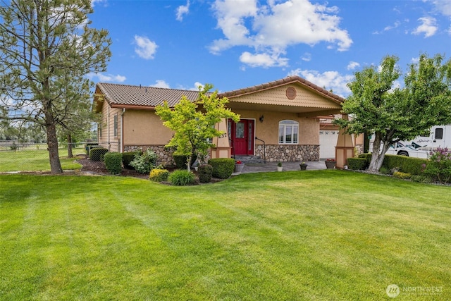 237 Reeds Rd, Touchet, WA 99360 - view of front of house featuring stucco siding, stone siding, and an attached garage